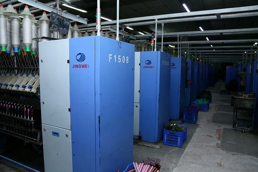 Karotoa Green spinning mill production floor with Jingwei F1508 textile machinery in operation.